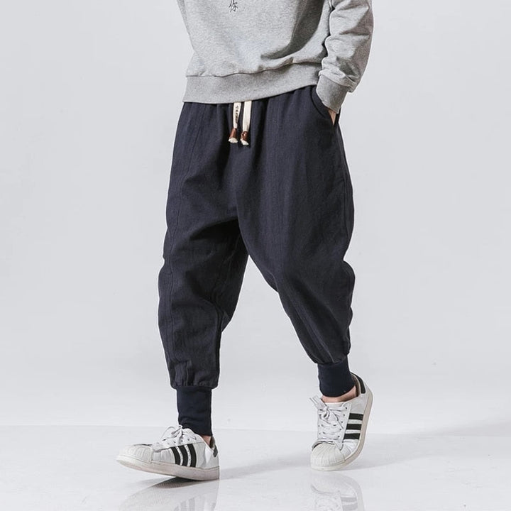 Stylish men's grey cotton harem pants, offering a comfortable, relaxed fit for daily wear.