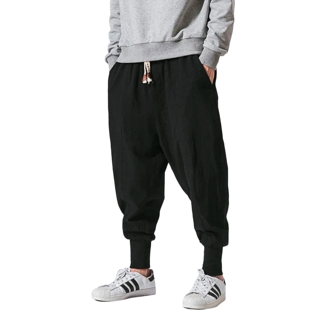 Men's versatile harem joggers for relaxed style, comfortable for travel, lounging, or light athletic activities.