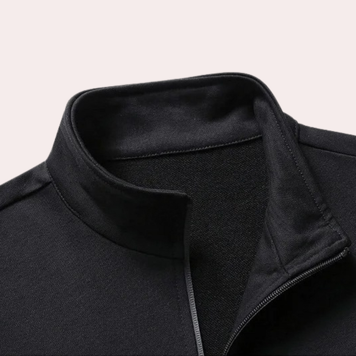 Man relaxing in Owen men's tracksuit. Stylish and comfortable loungewear, perfect for a casual outfit at home.