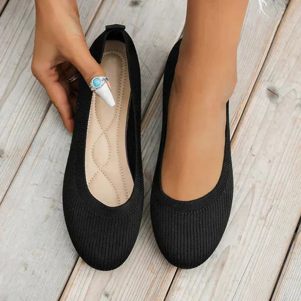 Pair of women's lightweight walking shoes, featuring orthopedic foot support & breathable material for ultimate comfort.
