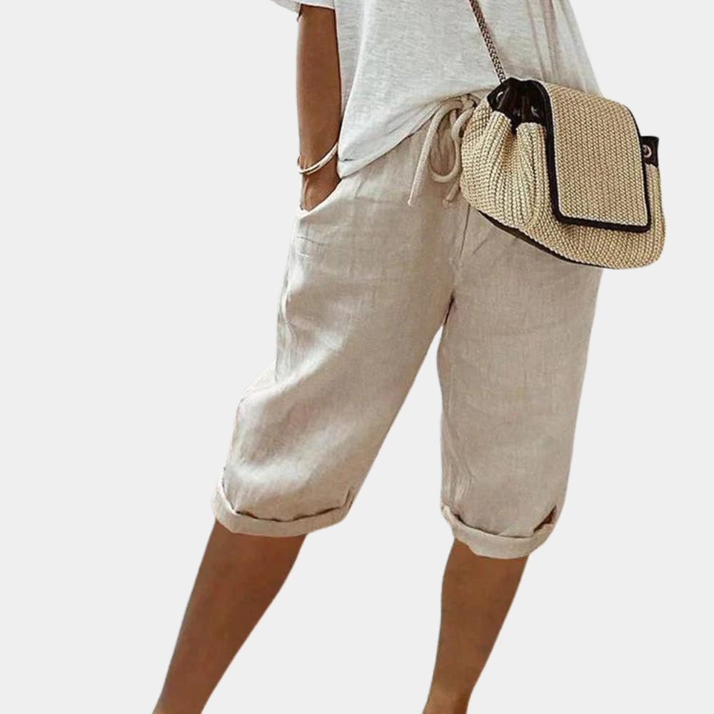 Woman wearing comfortable elastic summer shorts, enjoying a casual day out. Versatile & stylish.