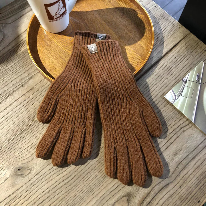 Soft women's winter gloves with touchscreen compatibility, perfect for cold weather.