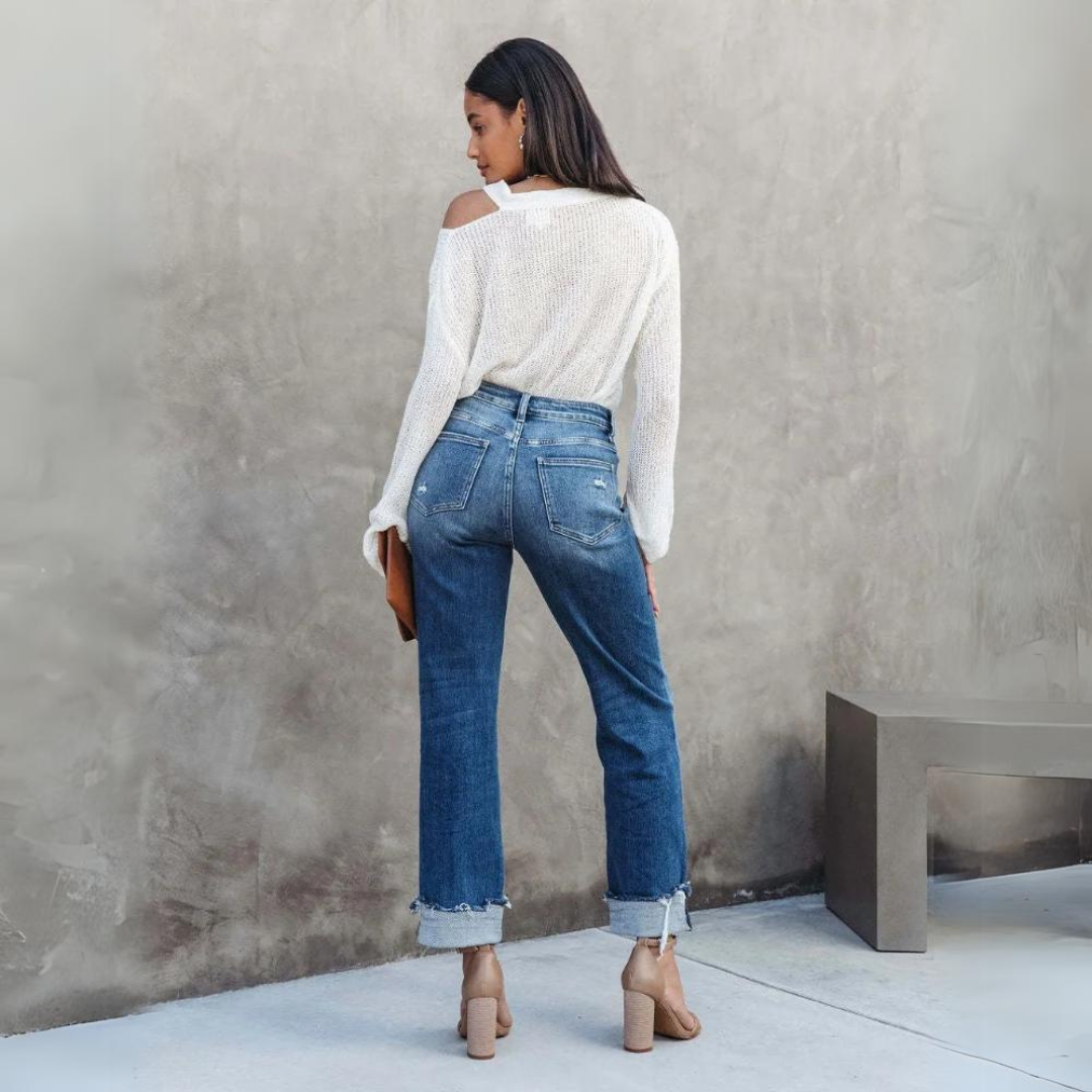 Close-up of Elise women's comfortable high-waisted relaxed fit jeans, highlighting durable denim texture for everyday wear.