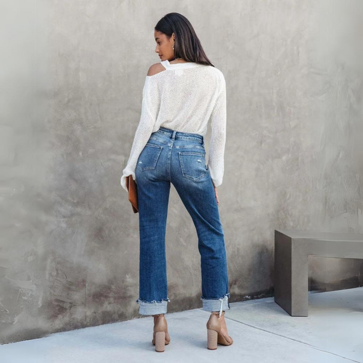 Close-up of Elise women's comfortable high-waisted relaxed fit jeans, highlighting durable denim texture for everyday wear.