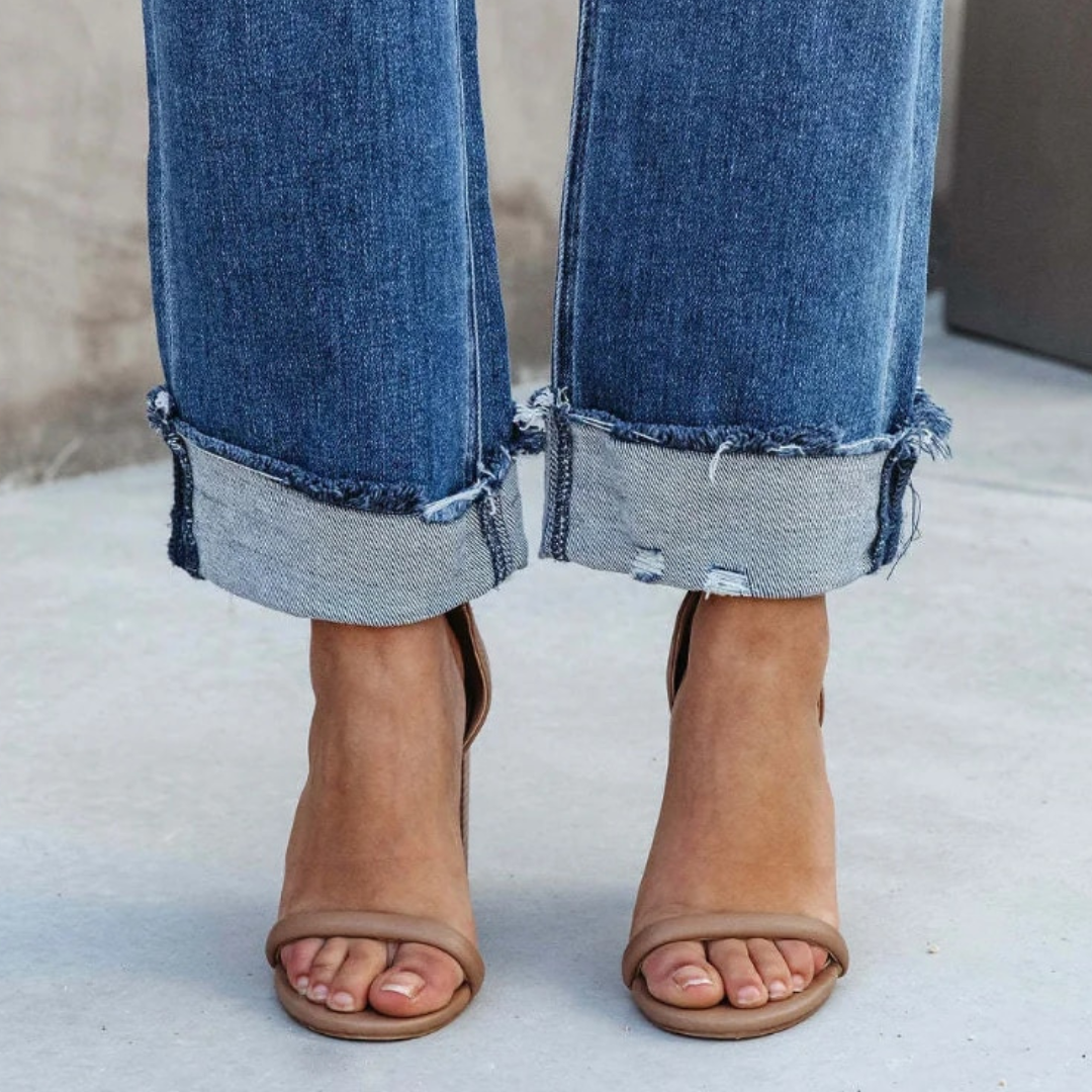 Woman wearing chic Elise high-waisted relaxed fit jeans, showcasing comfortable, versatile women's fashion for casual style.