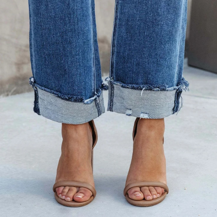 Woman wearing chic Elise high-waisted relaxed fit jeans, showcasing comfortable, versatile women's fashion for casual style.