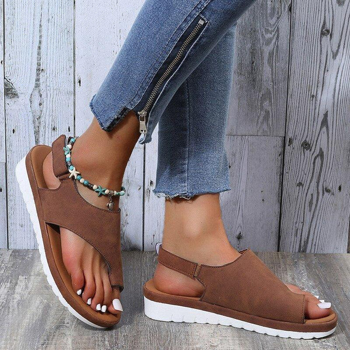 Black women's bunion sandals with a wide toe box, back strap, and comfortable arch support.
