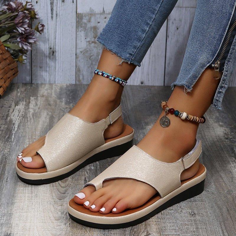 Brown women's bunion sandals featuring a wide toe box, secure back strap, and orthopedic design.