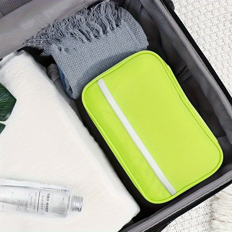 Blue travel toiletry bag with multiple compartments, hangs easily.