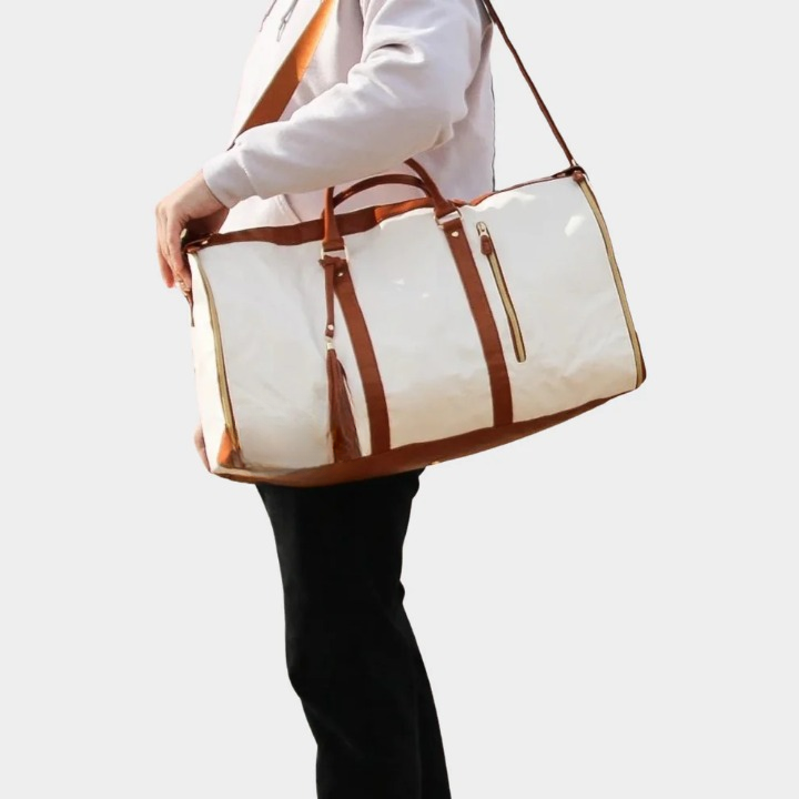 Luxury unisex travel bag, a stylish PU leather duffel and garment carrier for sophisticated trips.