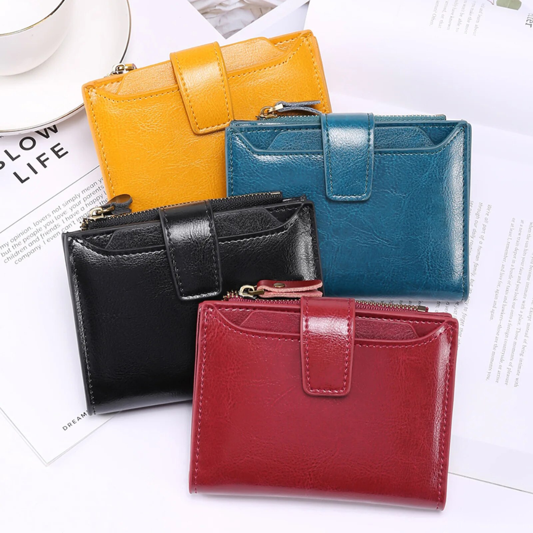 Organized card slots inside a compact women's leather wallet.