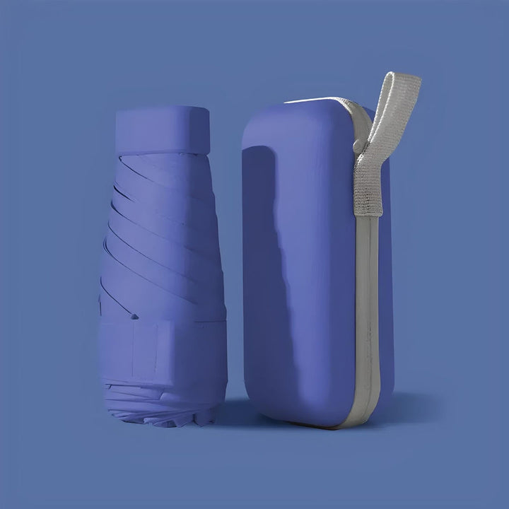 A lightweight travel umbrella unfurled, demonstrating its windproof construction and coverage.