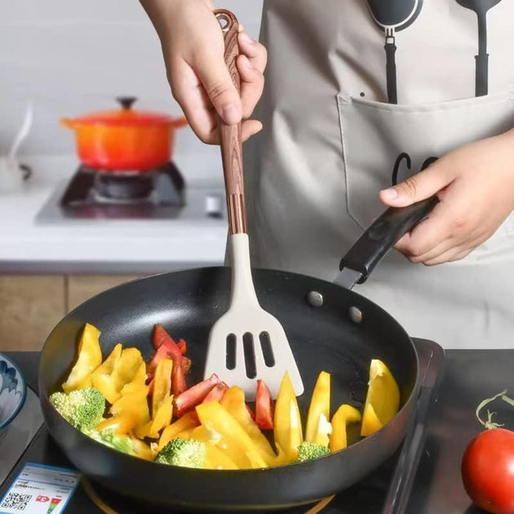 Essential 10-piece silicone kitchen utensil set with wood-look handles for all your cooking and baking needs.