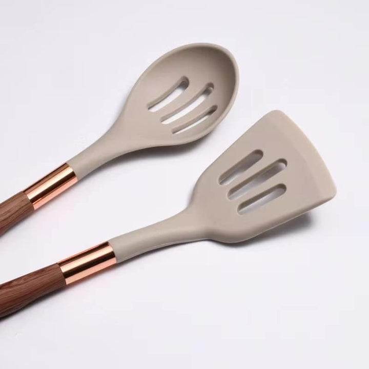 Complete 10-piece modern silicone kitchen utensil set, easy to use & clean, with ergonomic wood-look handles.