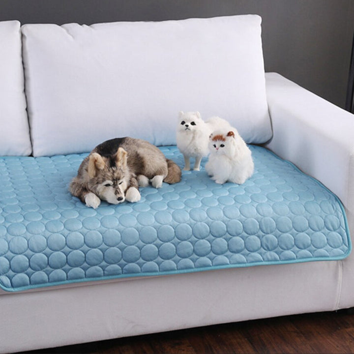 Portable pet cooling mat for dogs & cats. Washable summer pet accessory offering instant heat relief & comfort.