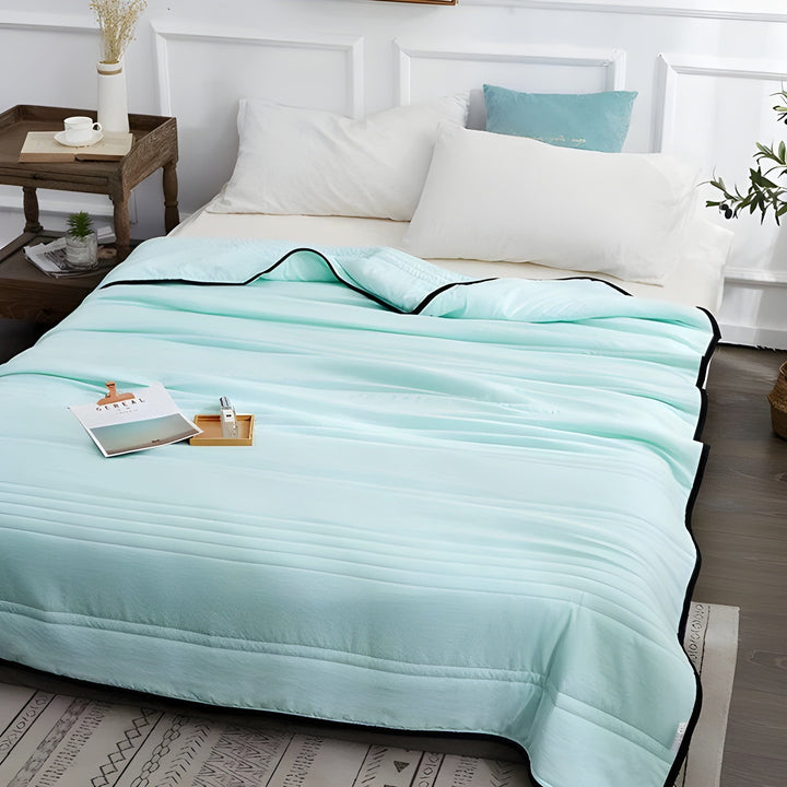 Ultra-Cooling Sleep Blanket for refreshing rest. Breathable bedding for hot sleepers to ensure summer comfort.