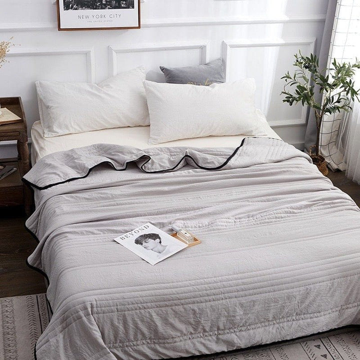 Soft, breathable cooling blanket designed for hot sleepers. Provides refreshing comfort for a cool summer sleep.