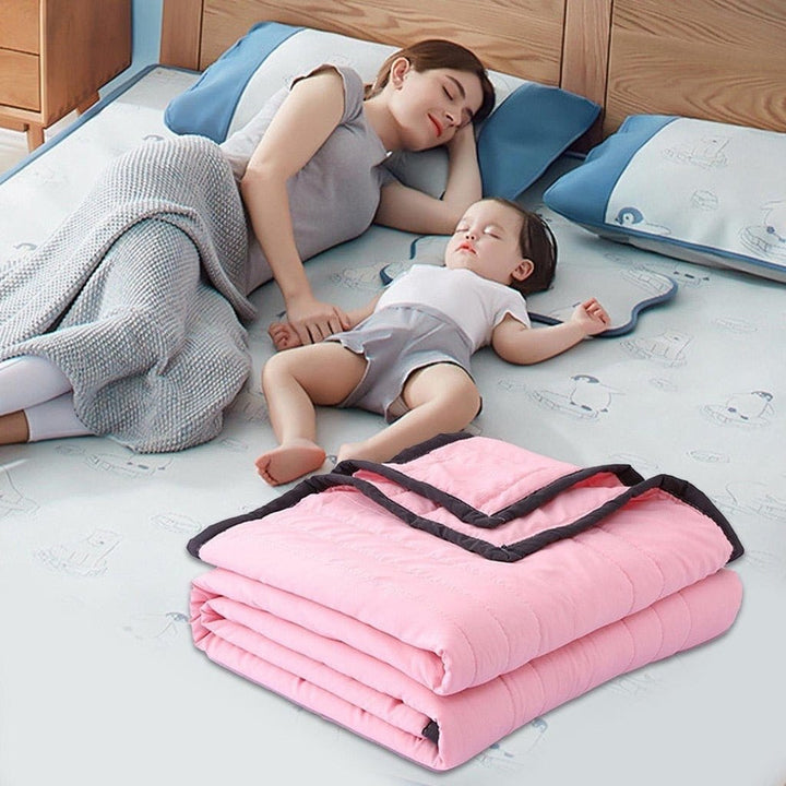 Stylish cooling blanket draped over a bed, creating a refreshing sleep environment. Perfect for hot sleepers.