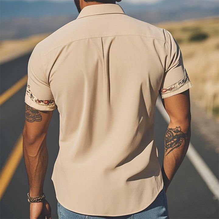 Classic men's western shirt featuring a unique floral print. Short sleeve & relaxed fit, ideal for summer fashion.
