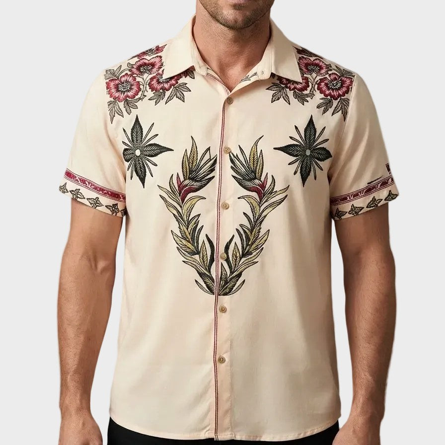 Men's stylish short-sleeve western shirt. Features a vibrant floral print, point collar, and comfortable relaxed fit.