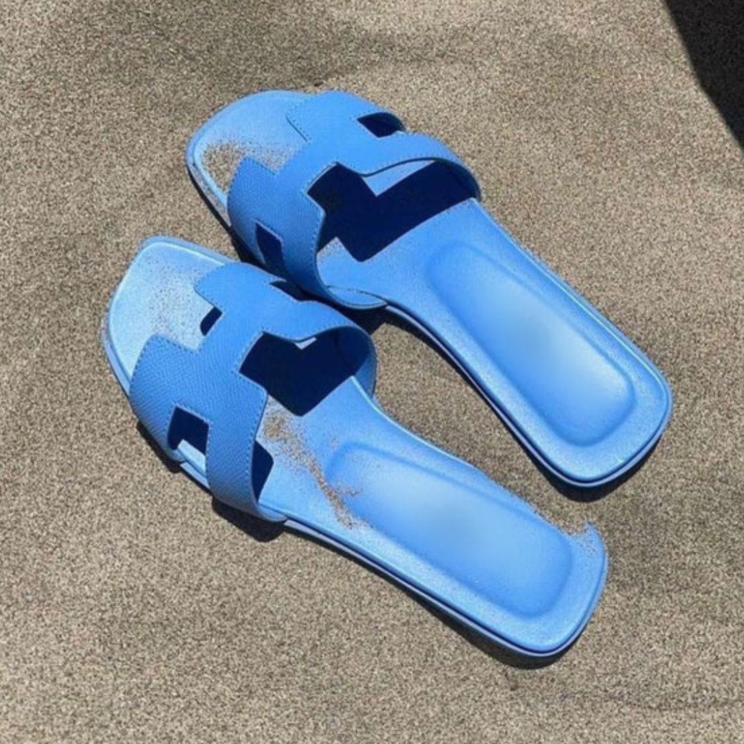Comfortable women's Cora open-toe slip-on sandals, designed for warm weather everyday wear. Chic flat footwear.