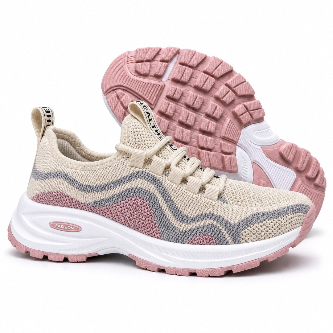 Product shot of women's lace-up sneakers, highlighting supportive design and all-day comfort.