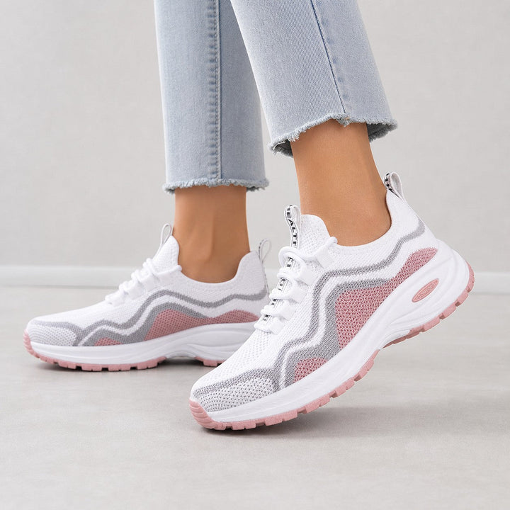 Woman wearing supportive lace-up walking shoes, ideal for active and casual everyday wear.