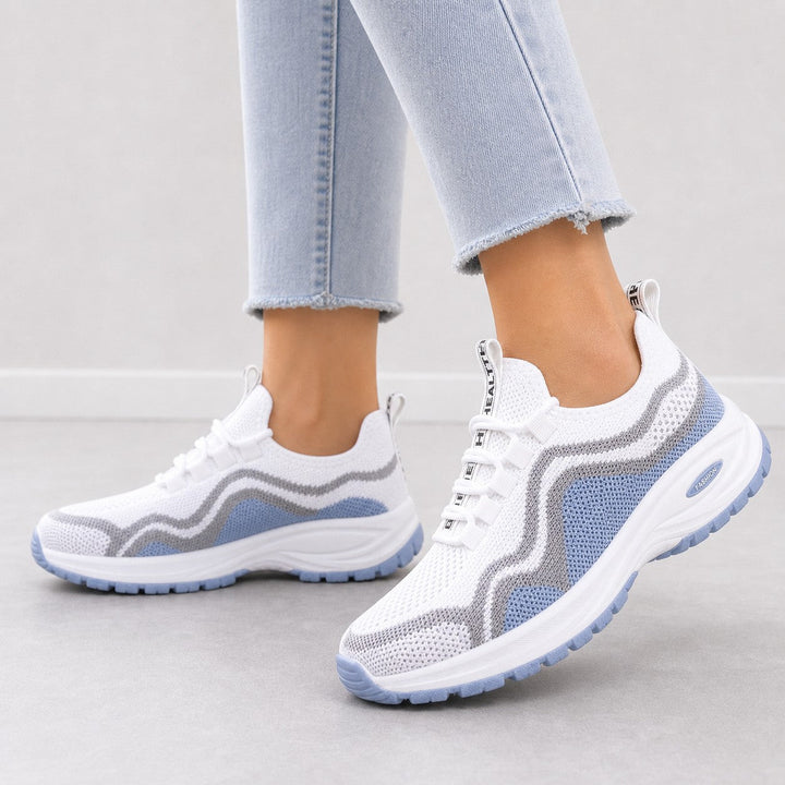 Woman enjoying a walk in comfortable and supportive lace-up women's walking shoes.