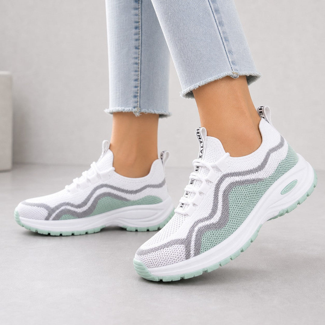 Collection of women's cushioned lace-up walking shoes in various colors for casual footwear.