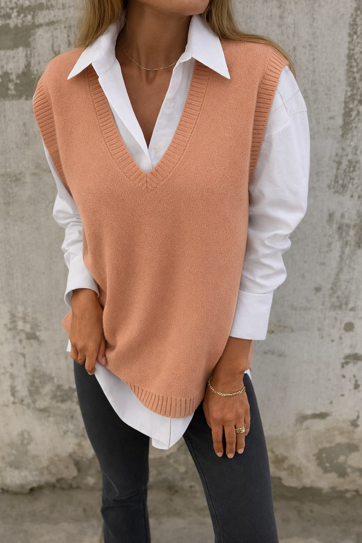 Chic women's V-neck sleeveless sweater vest. Elegant knit top for versatile fall & winter layering, perfect for office or casual wear.