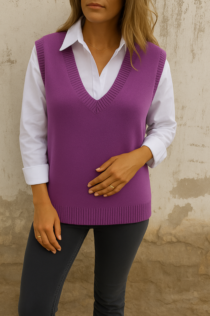 Elegant women's V-neck sleeveless sweater vest. Chic layering knit top, ideal for stylish fall & winter fashion outfits.