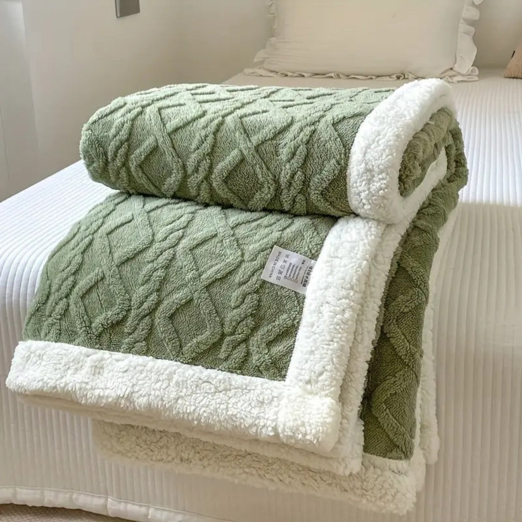 Luxurious soft sherpa blanket with a classic diamond knit pattern, perfect for cozying up.