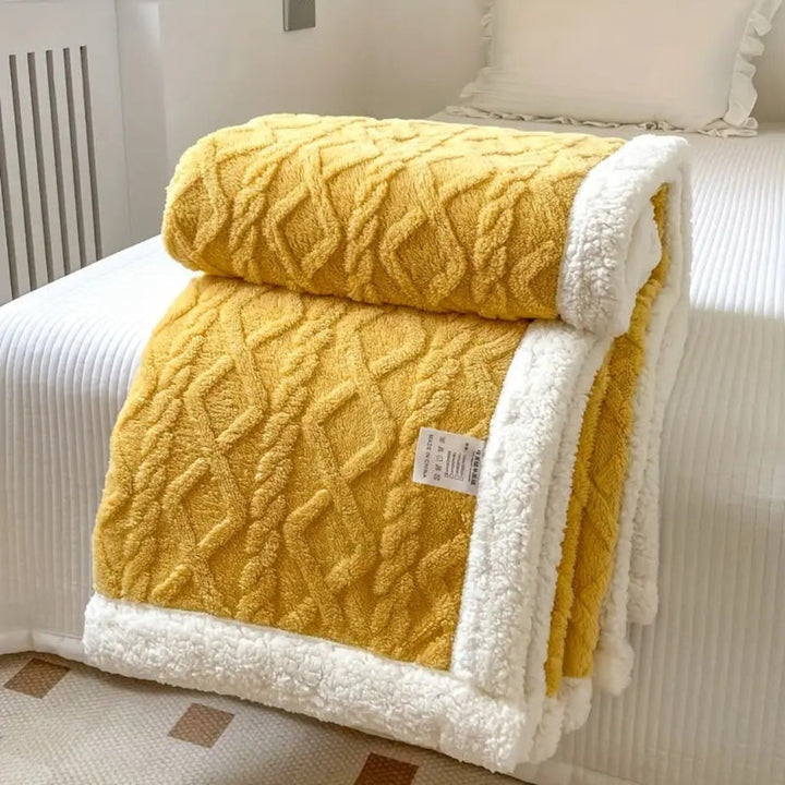 Plush reversible sherpa blanket in a cozy diamond knit design, ideal for all seasons.