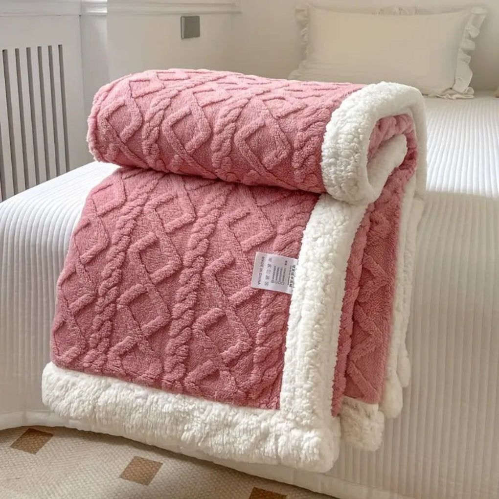 Experience ultimate comfort with this soft, plush sherpa blanket featuring a diamond knit.