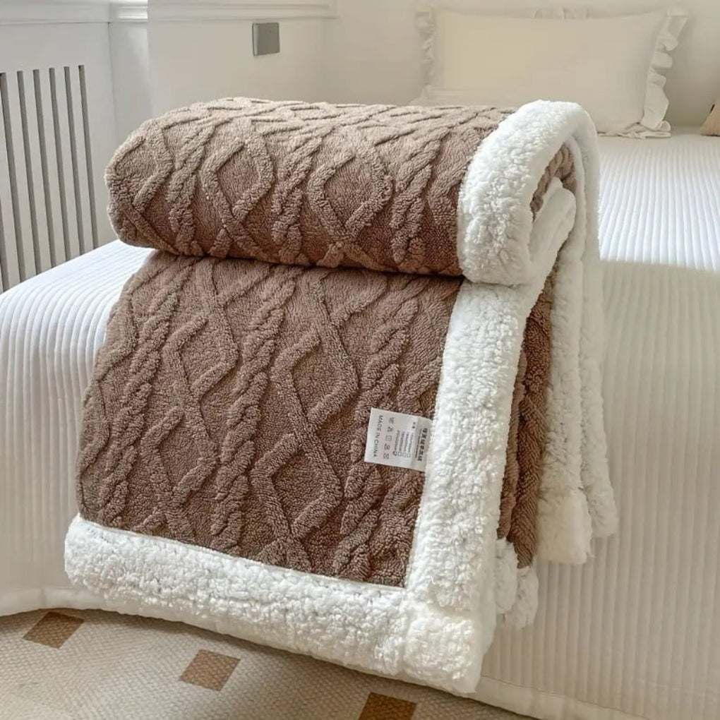 Ultra-soft reversible sherpa blanket showcasing an elegant diamond knit pattern.