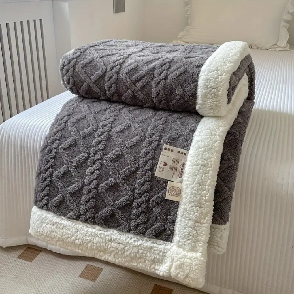 Chic diamond knit sherpa blanket: a soft, reversible throw perfect for any home.
