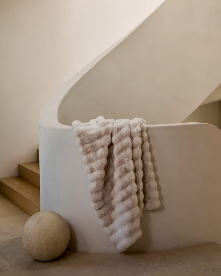 Sustainable white plaid fleece throw blanket, a cozy accent for any living space. Recycled polyester.