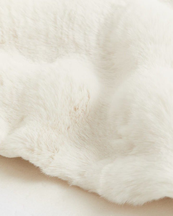 Warm white plaid fleece throw blanket, offering ultimate comfort and style for your home.