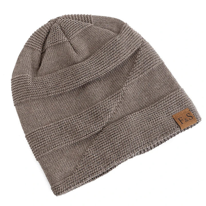 Stylish grey acrylic beanie hat for women, fleece-lined for extra warmth.
