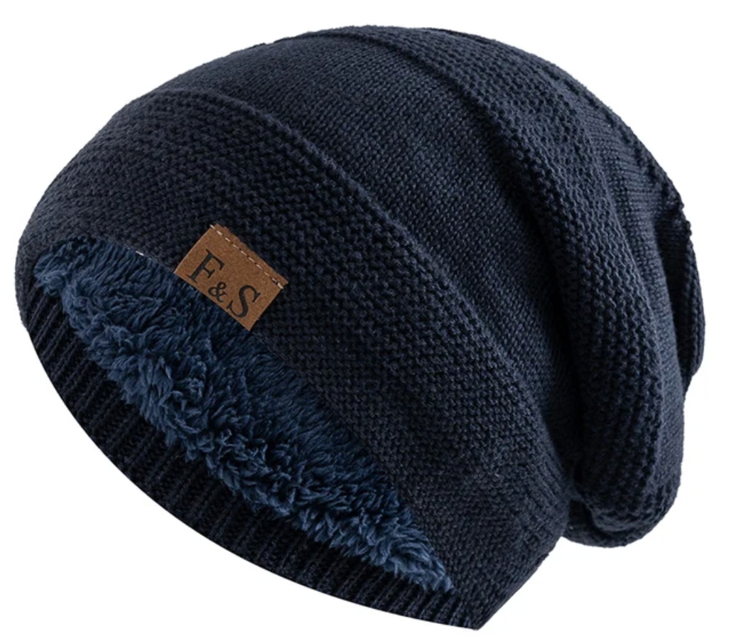 Close-up of a soft fleece lining inside a cozy winter beanie hat.