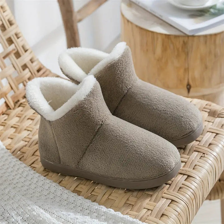 Plush-lined women's ankle boot slippers, perfect for winter comfort & soft indoor loungewear.