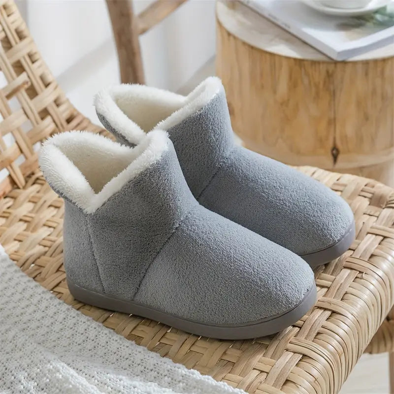 Stylish women's ankle boot slippers with a cozy lining, perfect for warm home comfort & indoor wear.