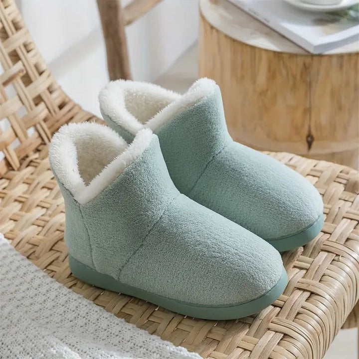 Warm women's house slippers with cozy lining & anti-slip sole for ultimate comfort & indoor safety.