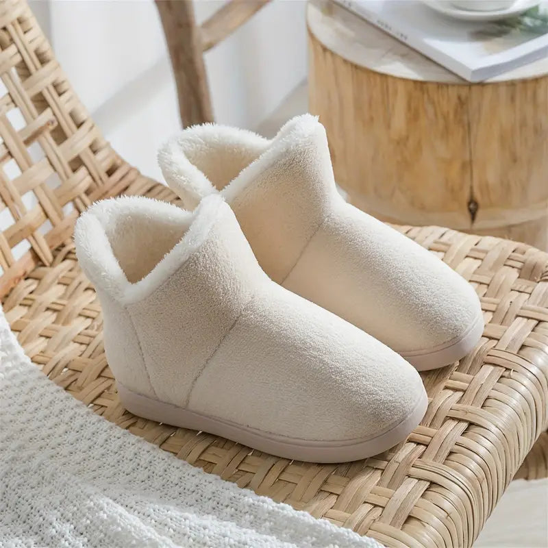 Soft women's cozy lined ankle boot slippers, offering luxurious warmth & comfort for indoor winter wear.