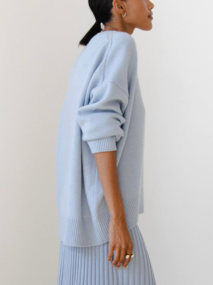 Fashionable oversized knit sweater in a deep navy, suitable for winter wear.