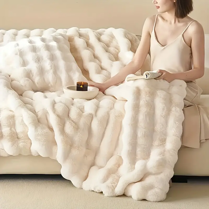 Ultra soft faux fur throw blanket, perfect for cozy comfort in your living room or bedroom decor.