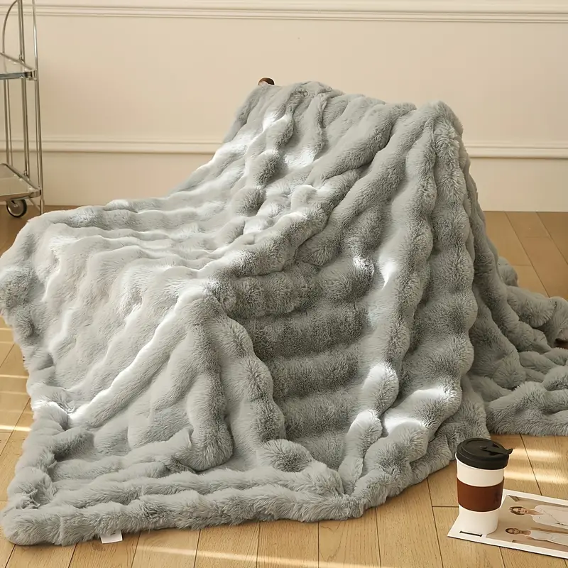 Premium ultra soft faux fur blanket, a cozy and plush throw for luxurious living room or bedroom decor.