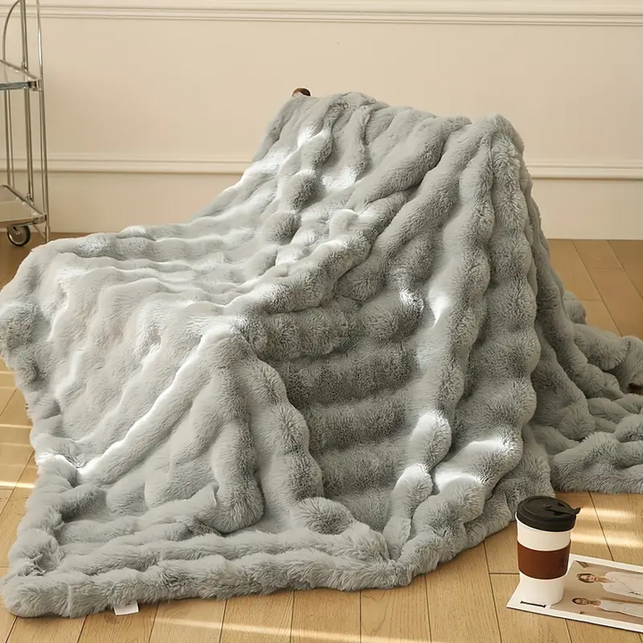 Premium ultra soft faux fur blanket, a cozy and plush throw for luxurious living room or bedroom decor.