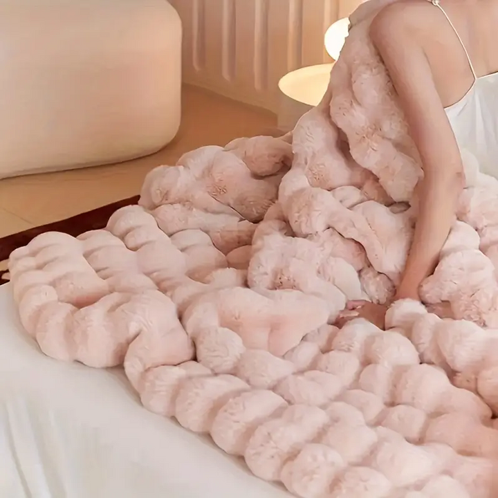Soft faux fur blanket, a comfortable and decorative throw for your sofa, bed, or armchair. Machine washable.