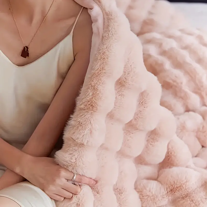 Machine washable faux fur throw, ultra soft and comfortable, enhancing your living room or bedroom decor.